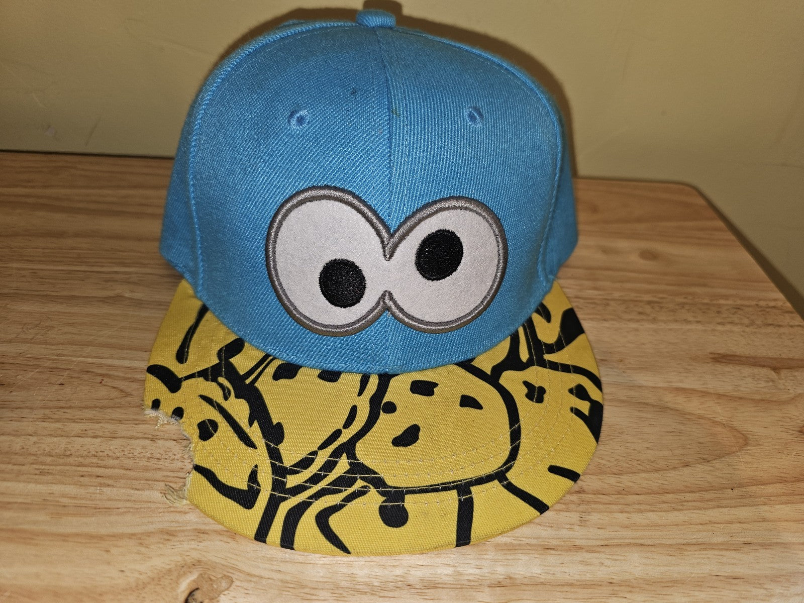 Ball Baseball cap appears there is a bite out of it