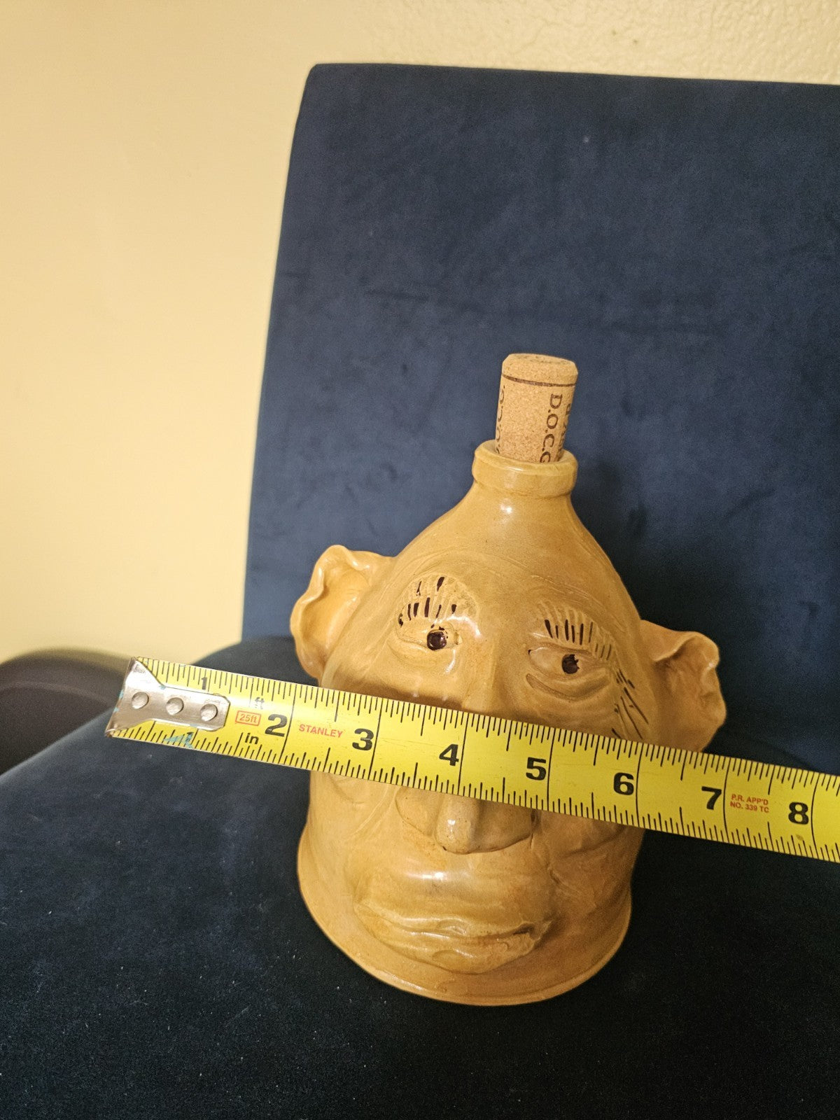 Vintage Art Moonshine jug or handmade clay sculpture a head with a cork